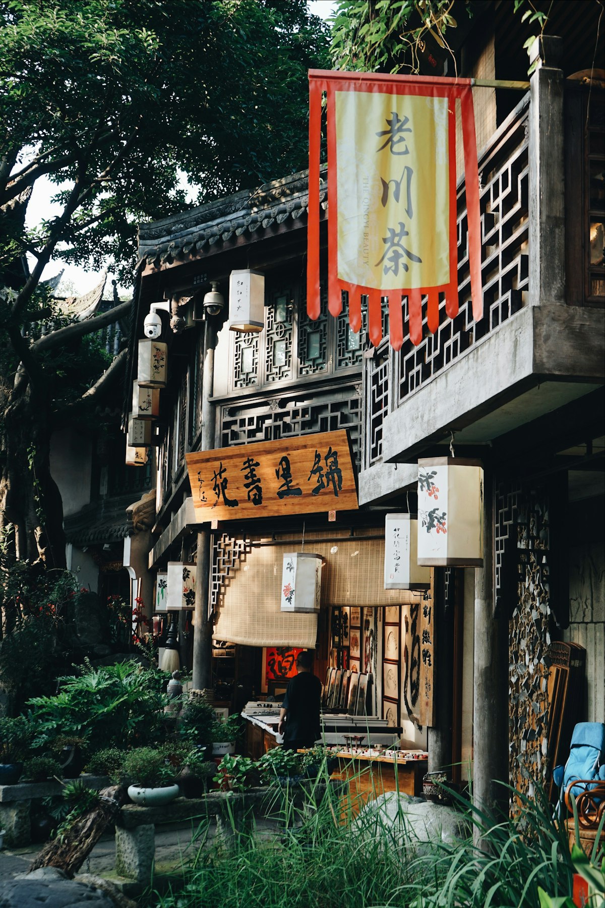 Traditional teahouse signs hanging over an old lane in Chengdu
