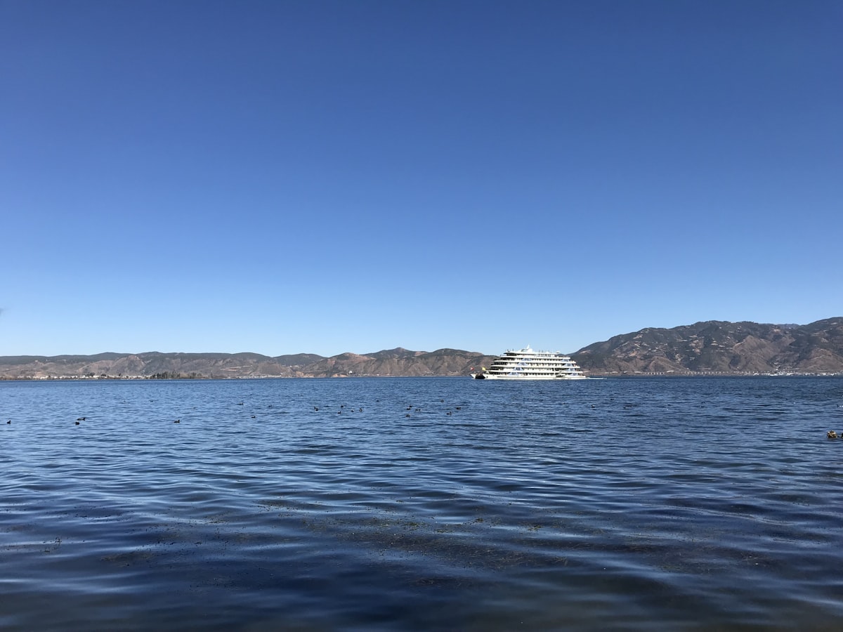 Cruise boat on the clear blue water of Erhai Lake near Dali