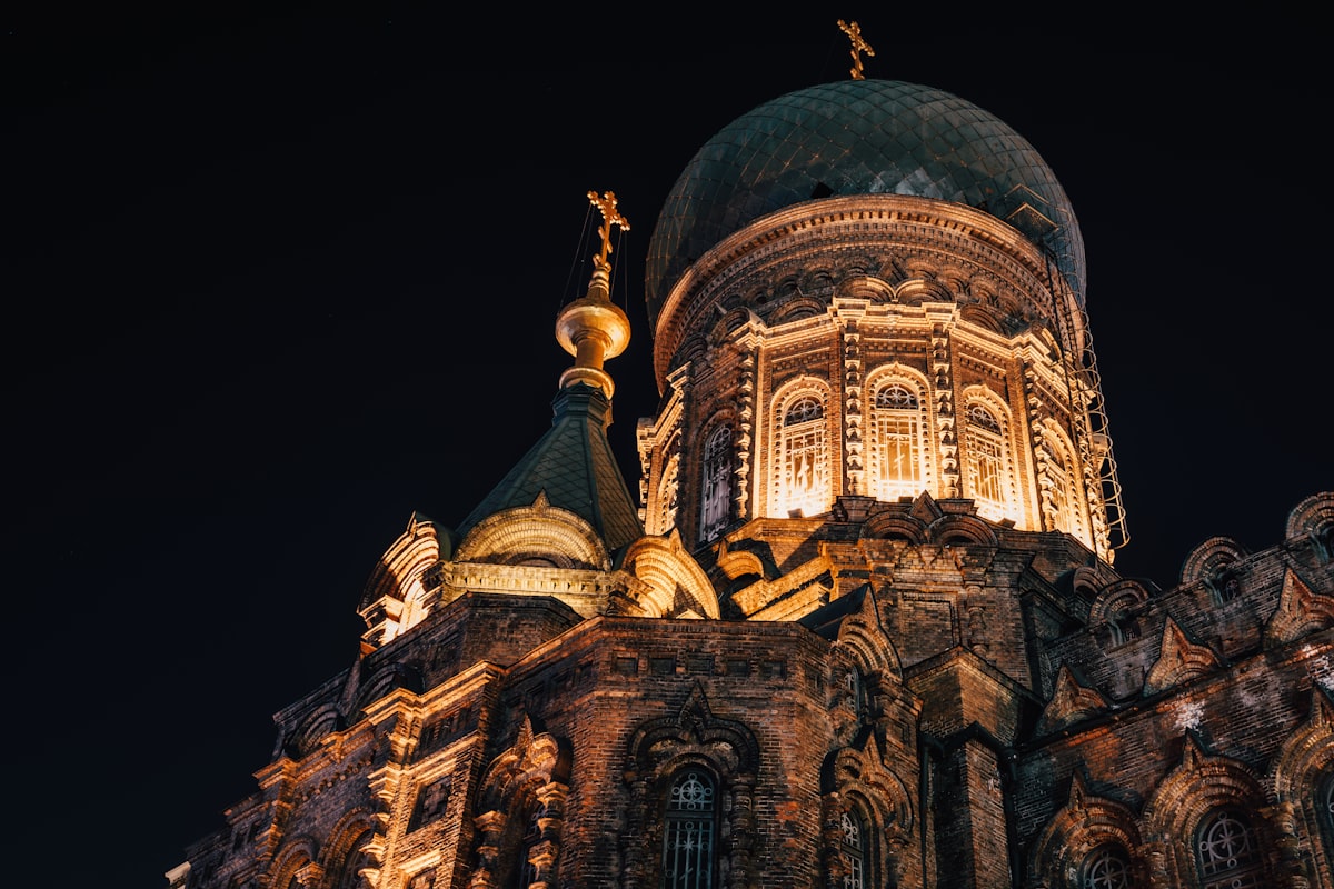 Floodlit dome and spires of Saint Sophia Cathedral, Harbin, at night
