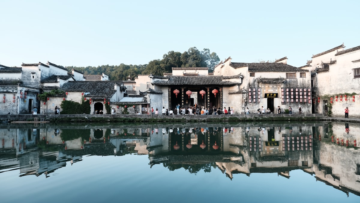 Whitewashed Hui houses ringing the Moon Pond in Hongcun village near Huangshan