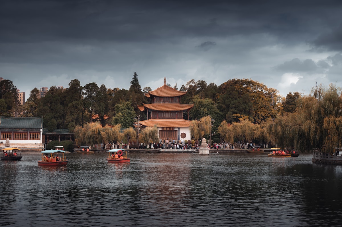 Daguan Pavilion and sightseeing boats on the lake at Daguan Park, Kunming