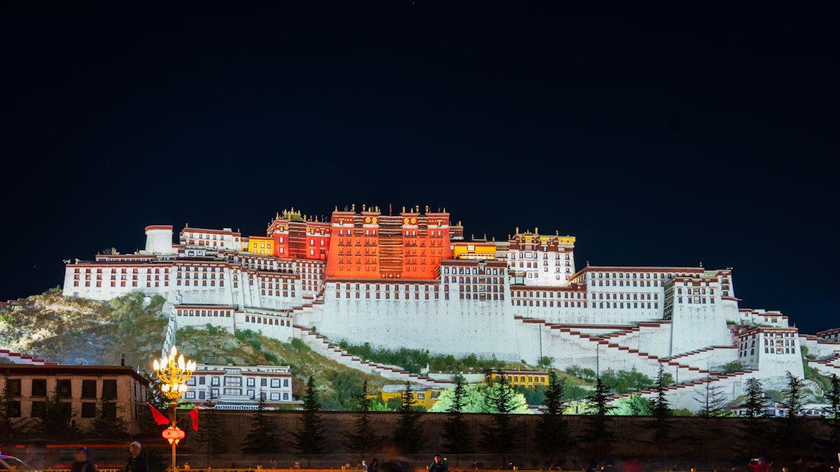 Potala Palace illuminated against the night sky in Lhasa