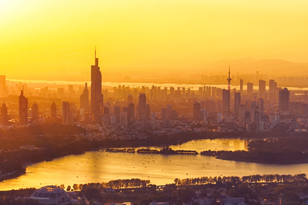 Golden sunset over Xuanwu Lake and the Nanjing skyline crowned by Zifeng Tower