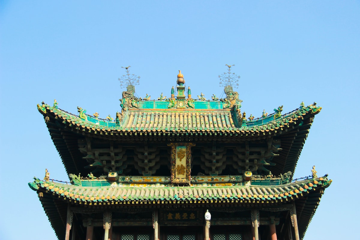 Green-glazed tiled roof of a traditional tower in Pingyao's old city