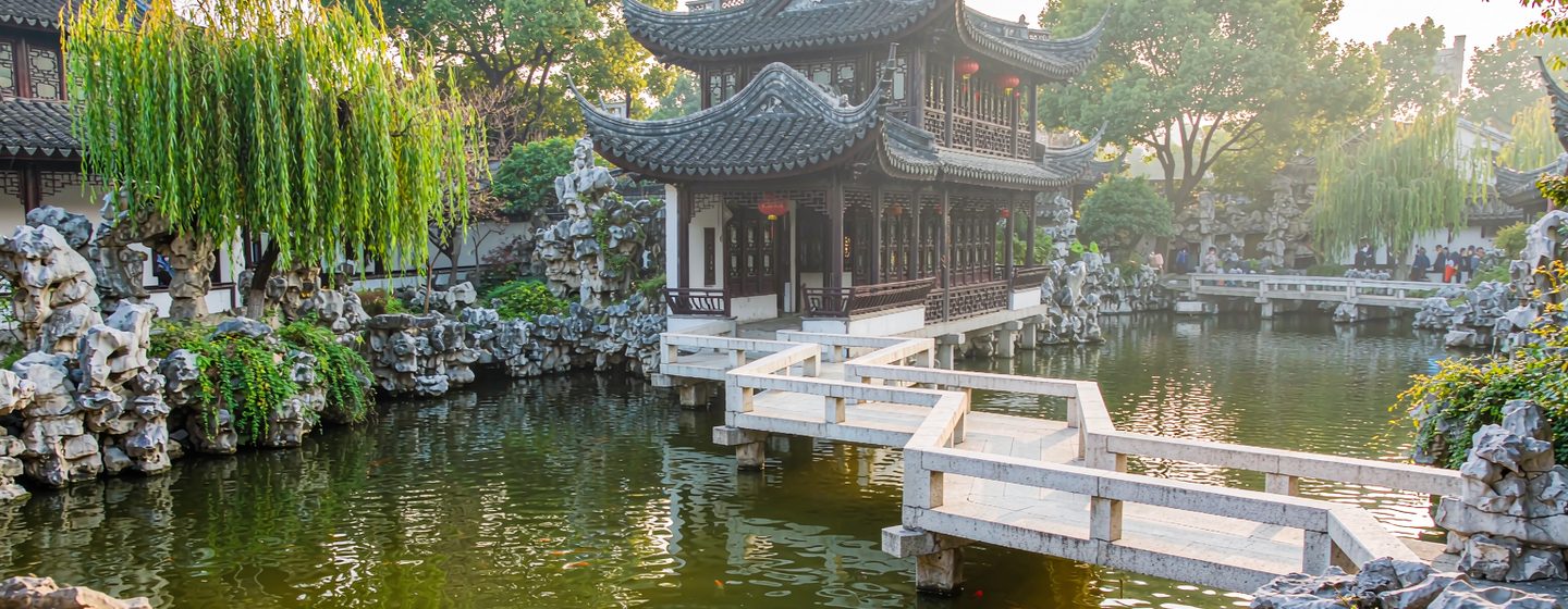 A pavilion and zigzag bridge over the pond in Yu Garden, Shanghai