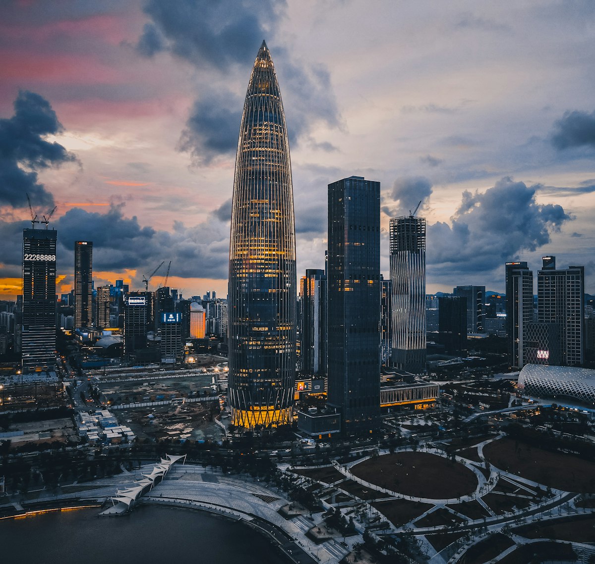 The bullet-shaped China Resources Tower in Houhai, Shenzhen, under dramatic dusk clouds