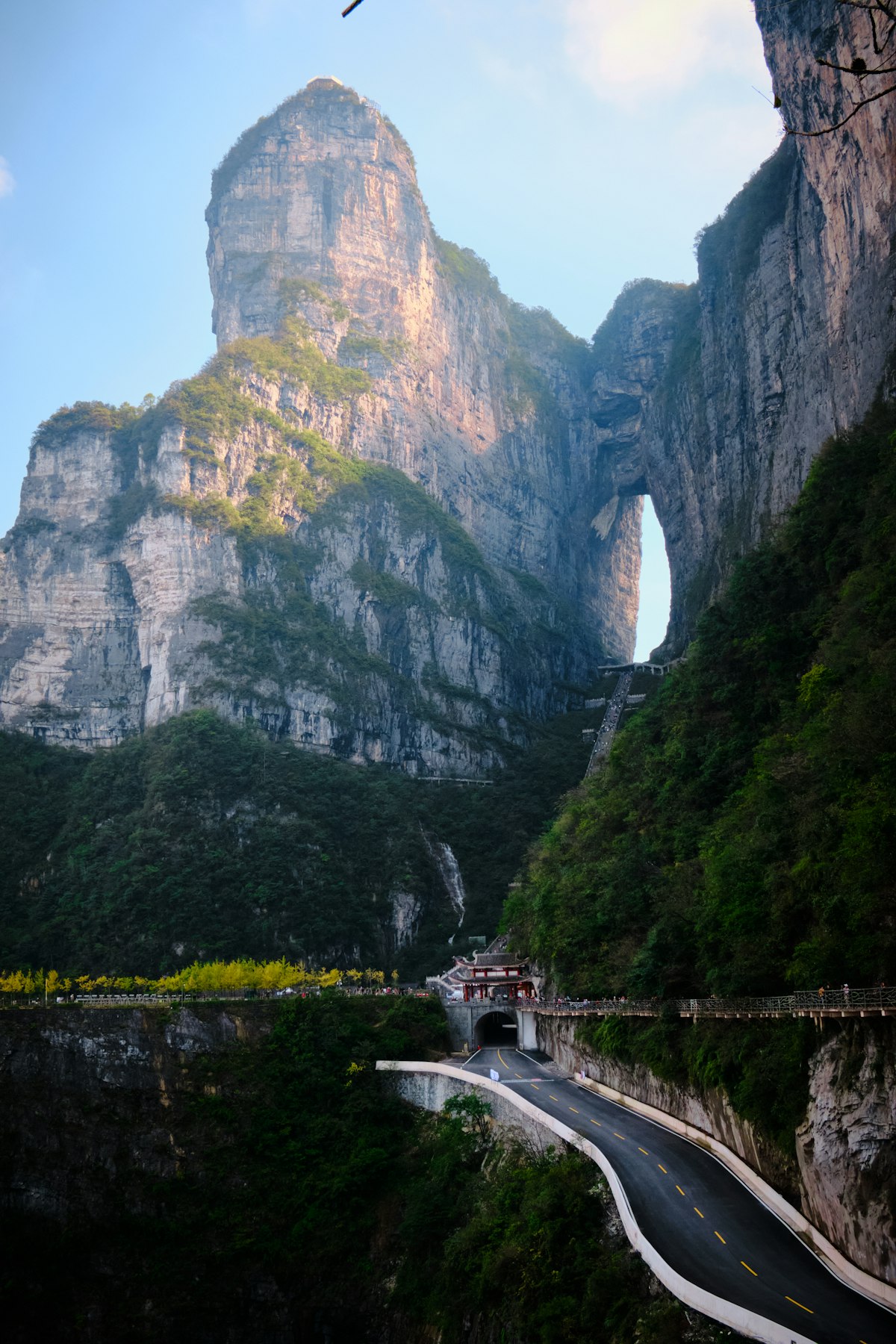 Heaven's Gate arch towering above the winding road at Tianmen Mountain, Zhangjiajie