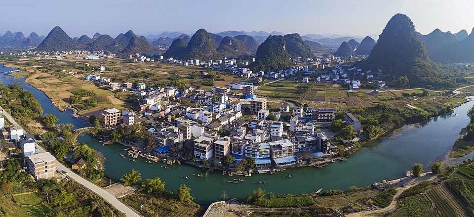 The green Yulong River valley winding past karst hills and rice paddies, Yangshuo