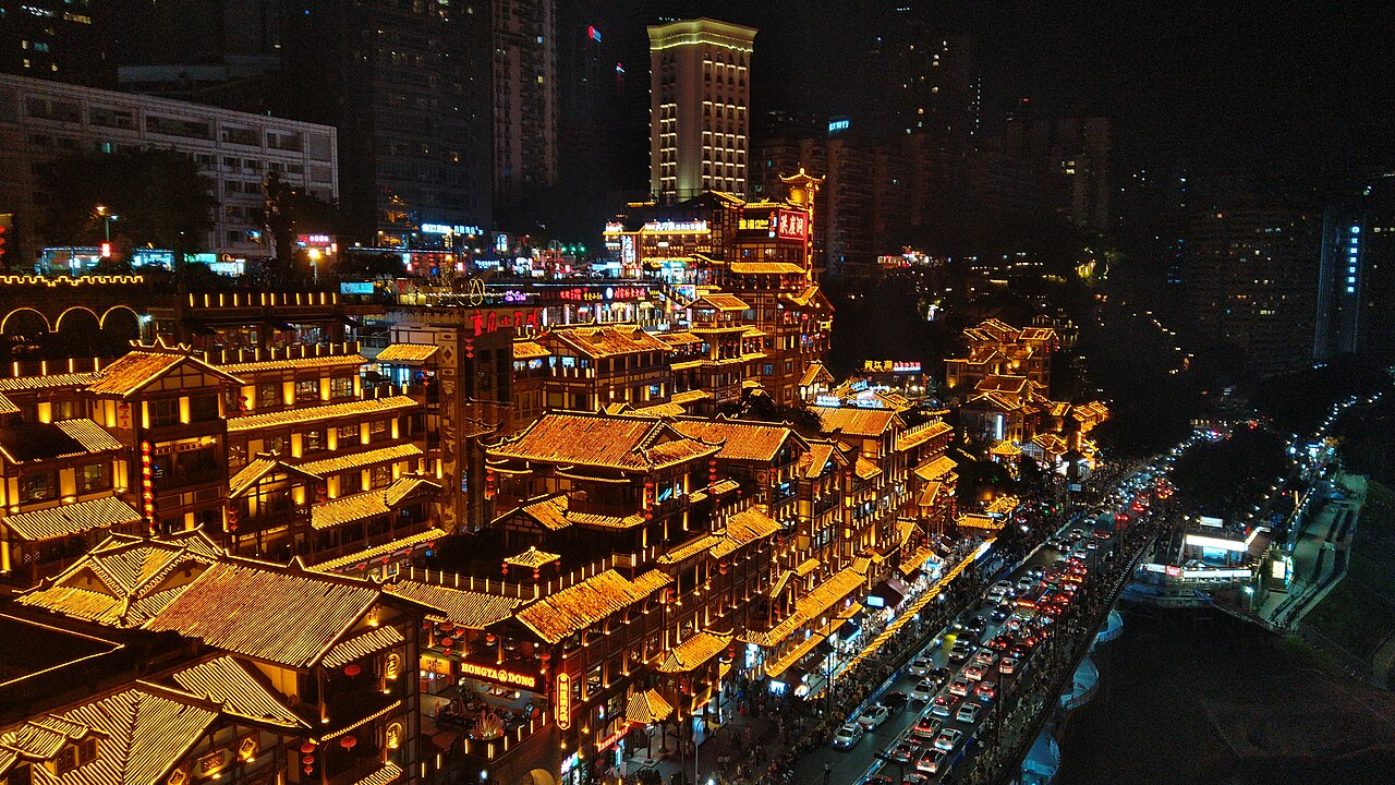 Hongya Cave lit up over the river in Chongqing at night