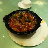 Mapo tofu in a black stone bowl, red with chilli oil and Sichuan pepper