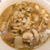 A bowl of pian'er chuan: noodles in brown broth with mushrooms and bamboo shoots