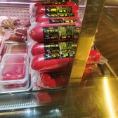 Packaged red sausage in a chilled shop display in Harbin