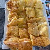 Strips of fried Naxi baba flatbread on a plate
