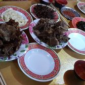 A table of yak meat and cheese dishes with dipping bowls