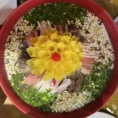 A bowl of mudan yancai arranged as a peony, the centre carved into petals