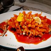 Squirrel mandarin fish, scored and fried, under a bright red sweet-and-sour sauce