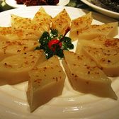 Slices of sweet osmanthus cake laid out in a flower on a plate