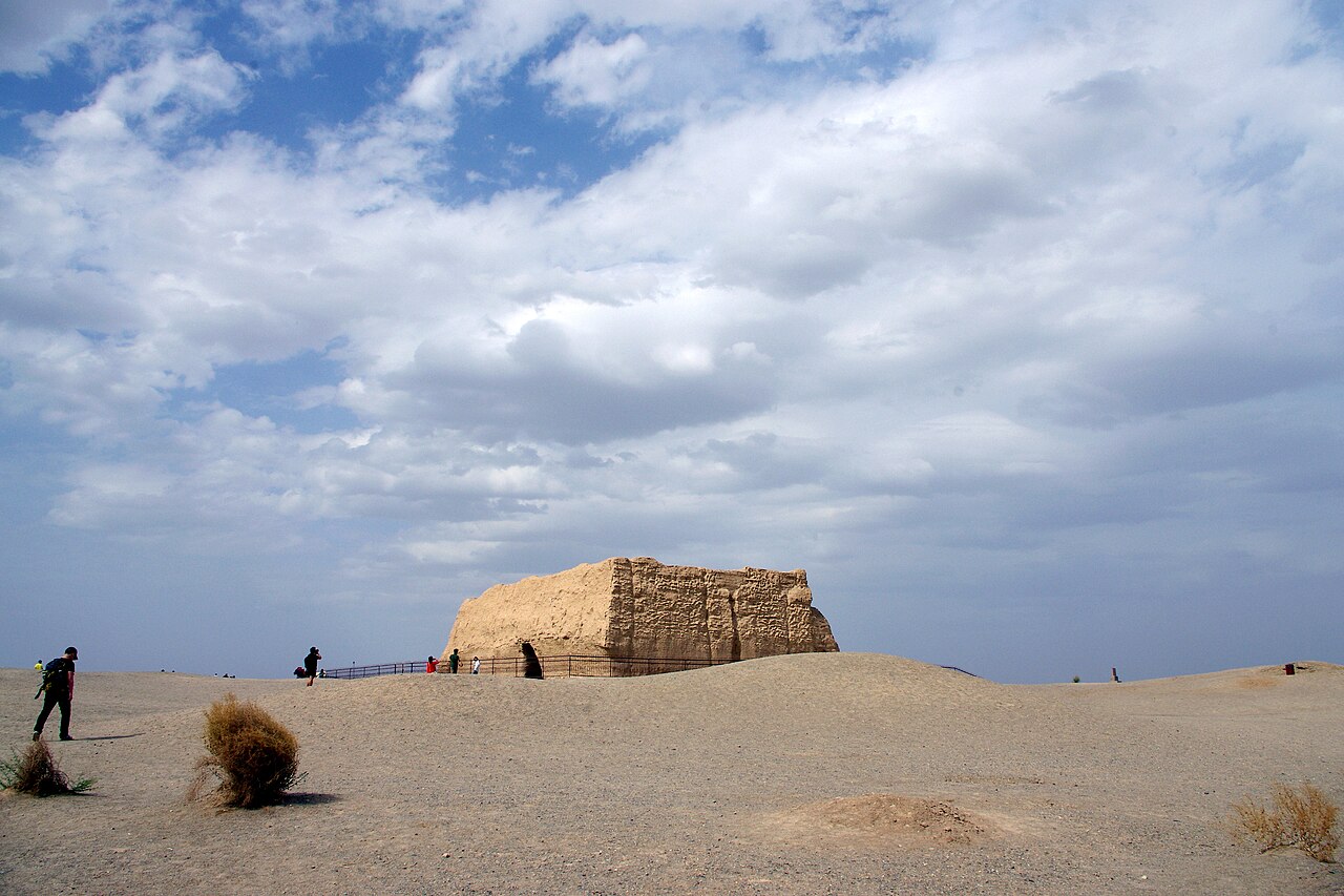 The rammed-earth fort of the Yumenguan Pass alone in the Gobi under a wide sky