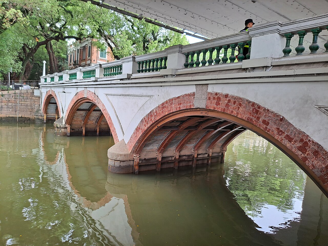 A stone arch bridge over the canal at Shamian Island, Guangzhou