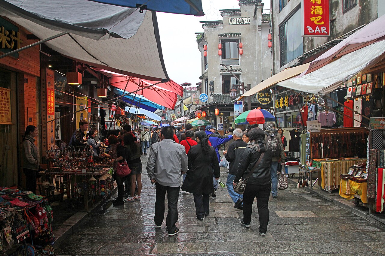 Stalls and shoppers filling West Street in Yangshuo