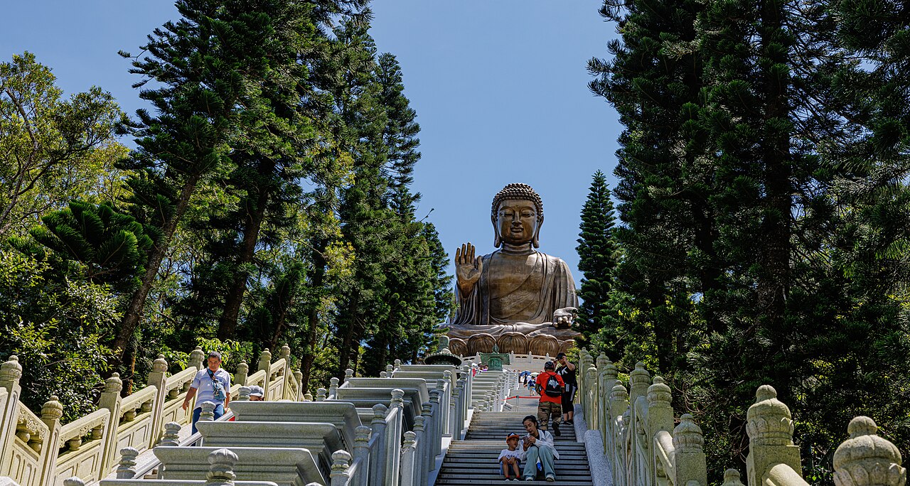 The Tian Tan Buddha seated at the top of its stairway on Lantau Island