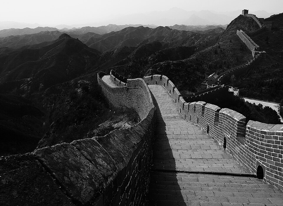 The Great Wall winding over green ridges near Beijing