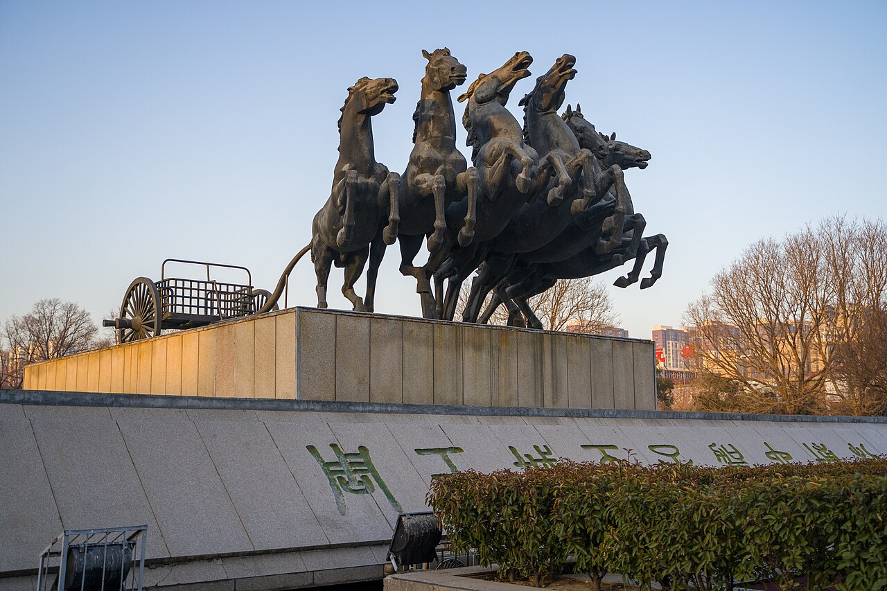 A bronze horse-and-chariot monument outside the Eastern Zhou chariot pits museum in Luoyang