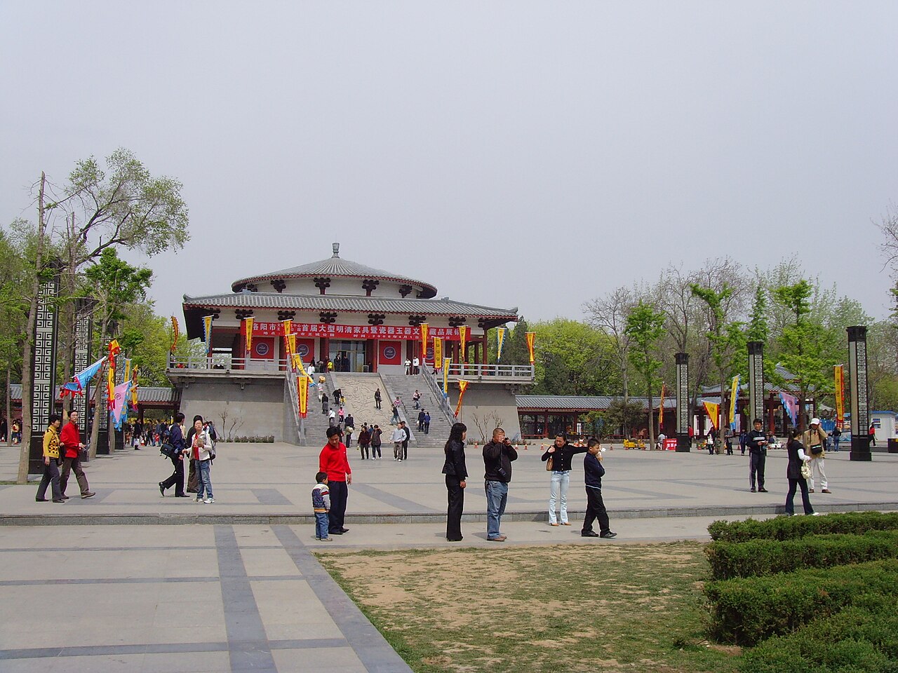 Visitors on the paved approach to a pavilion in Wangcheng Park, Luoyang