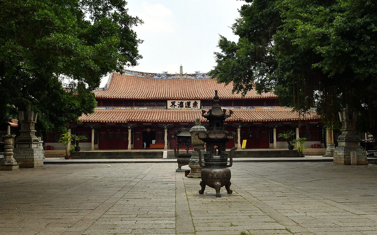 The main hall of Kaiyuan Temple behind a bronze incense burner