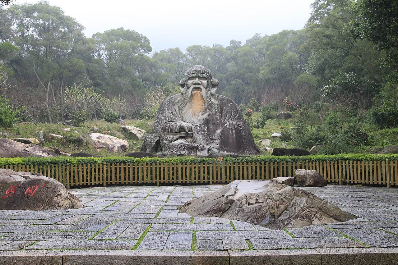 The giant Song-dynasty stone Laozi of Laojun Rock under the trees