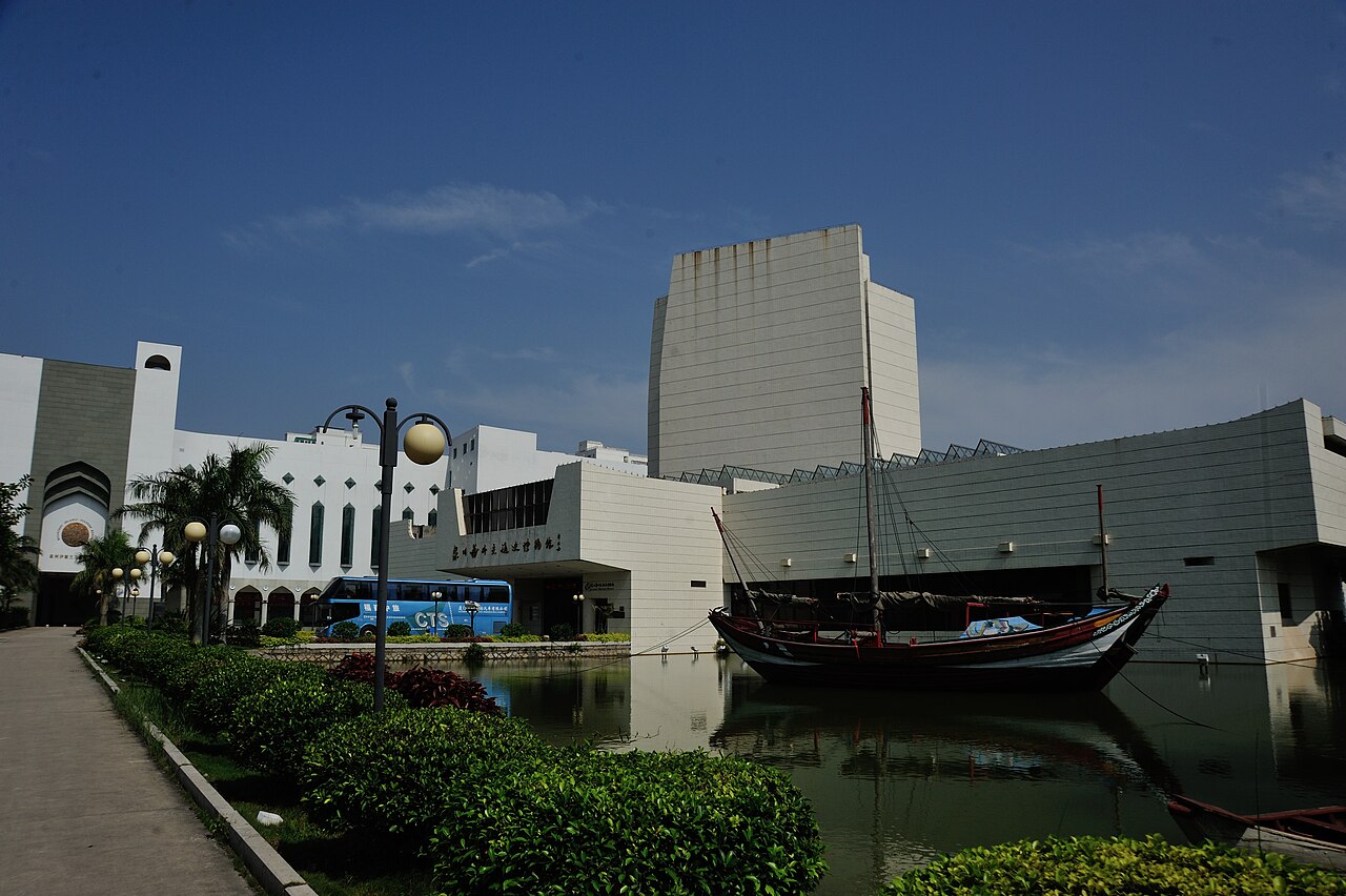 The Maritime Museum's modern halls with a historic ship moored outside