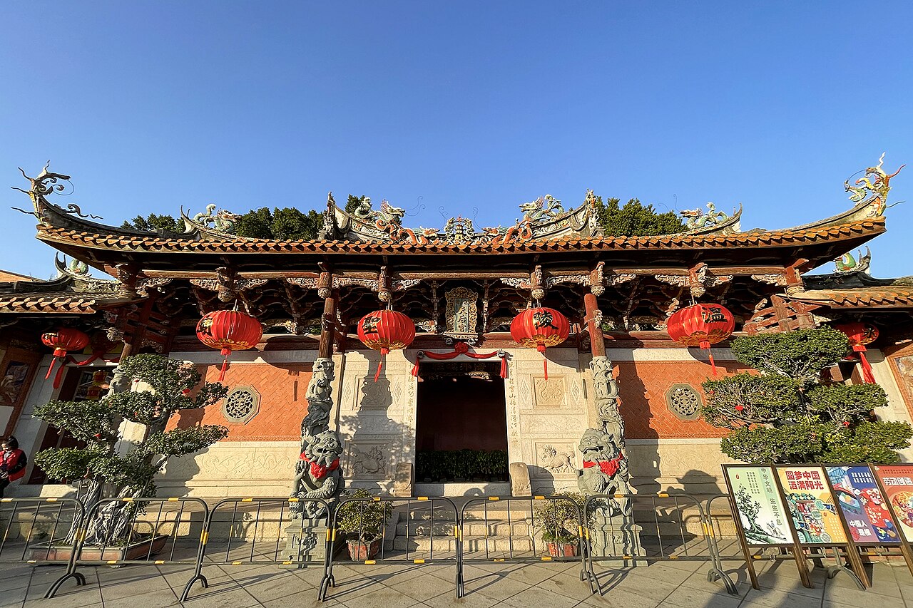 Red lanterns across the carved gate of Quanzhou's Tianhou Palace