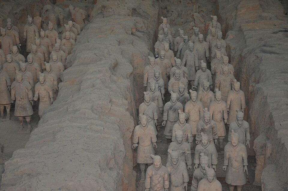 A wide view of terracotta warriors arranged in the excavation pits, Xi'an