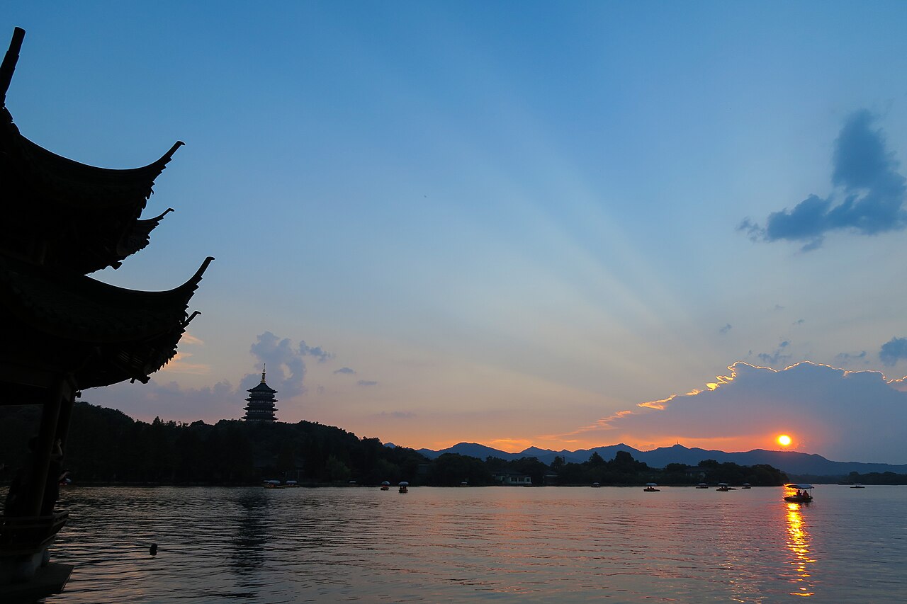 Leifeng Pagoda and West Lake glowing at sunset, Hangzhou