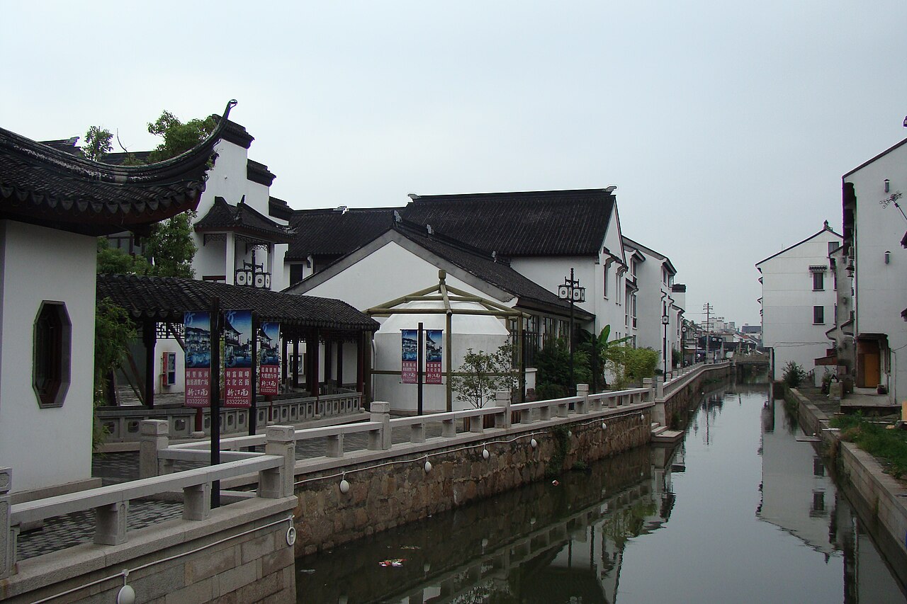A stone-banked canal and old houses in a water town near Suzhou