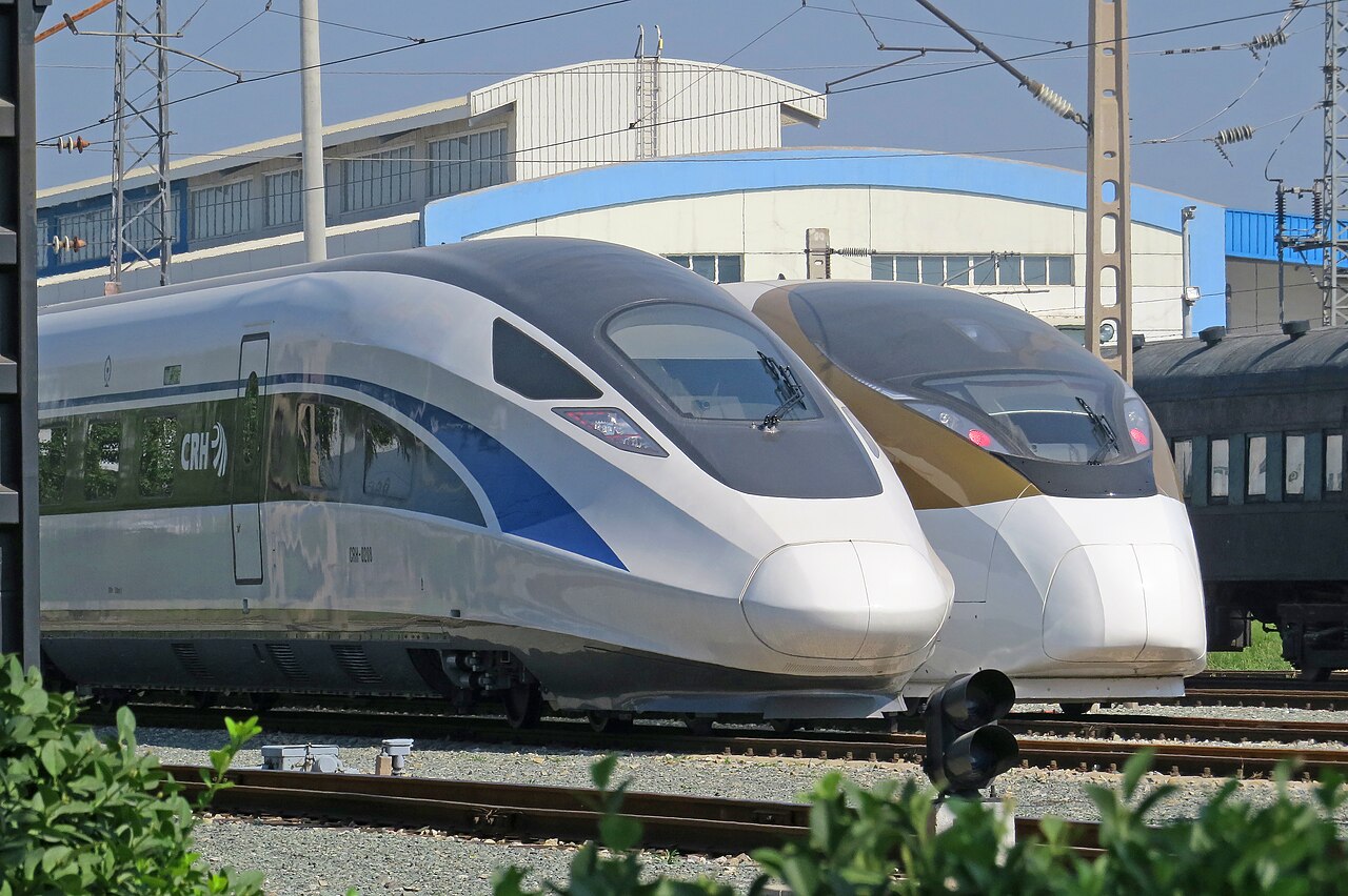 Two high-speed CRH trains side by side at a station