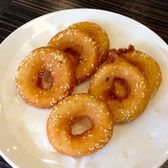 Five golden sesame-crusted mianwo rings, crisp at the edge and hollow at the centre