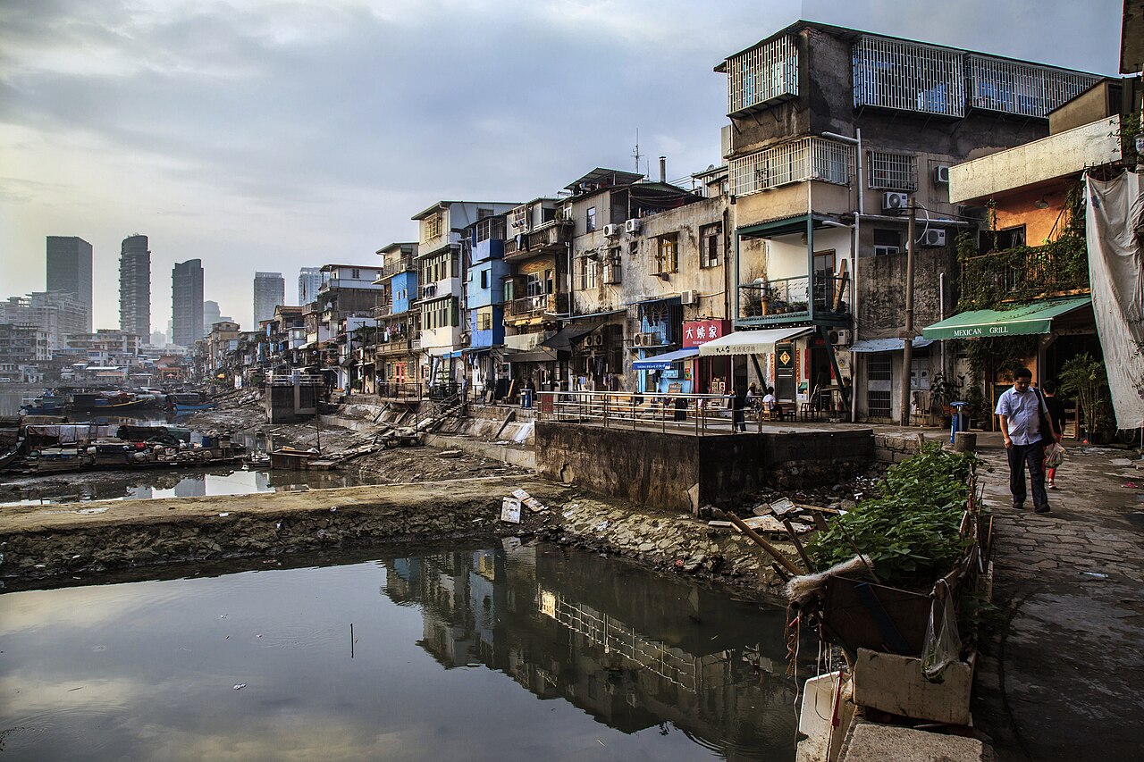 Old buildings around the harbour at Shapowei, Xiamen, with the new city behind