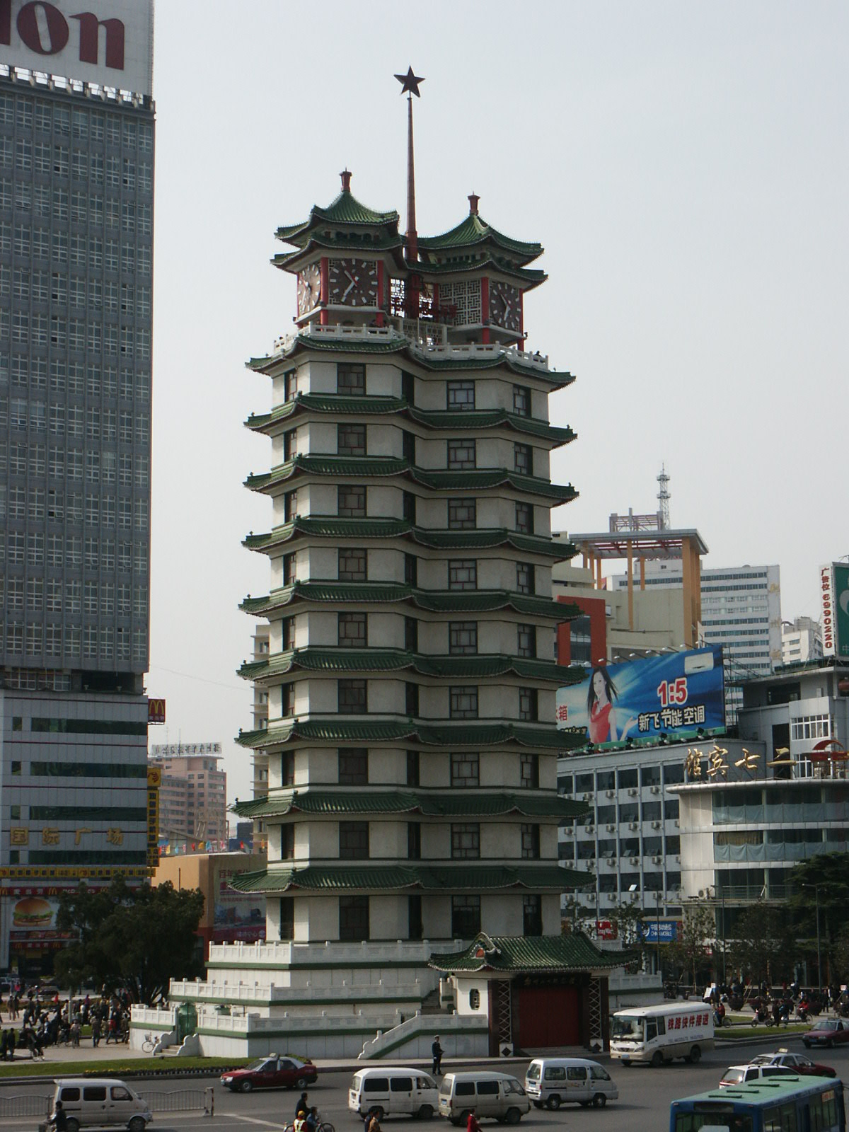 The twin pagoda towers of Erqi Memorial Tower rising over the city square.