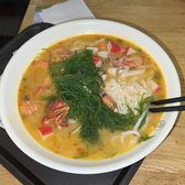 Live seafood tanks and cooked crabs at Sanya's First Market