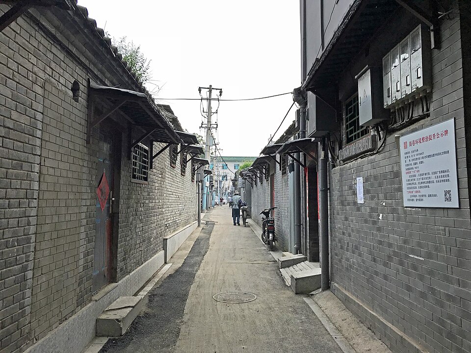 A grey-brick Beijing hutong lane