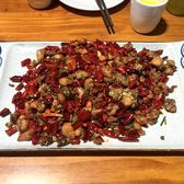 A plate of laziji — fried chicken pieces buried in dried red chillies