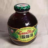 A chilled bottle of sour-plum drink on a cloth
