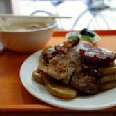 Fried pork ribs served over slabs of rice cake