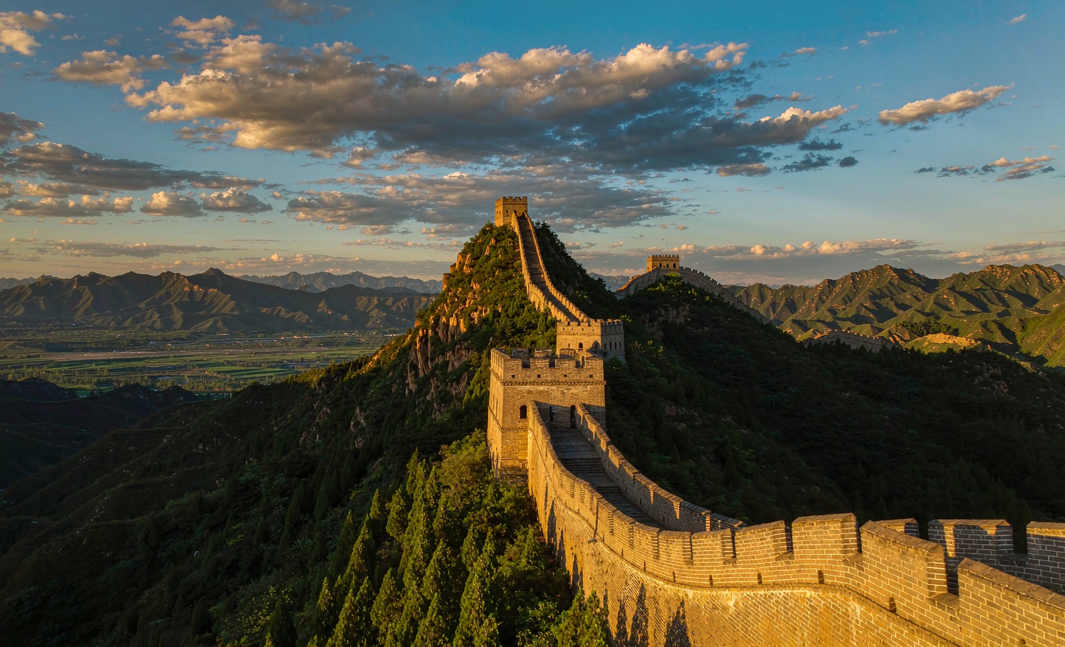 Simatai section of the Great Wall, with watchtowers on a green ridge