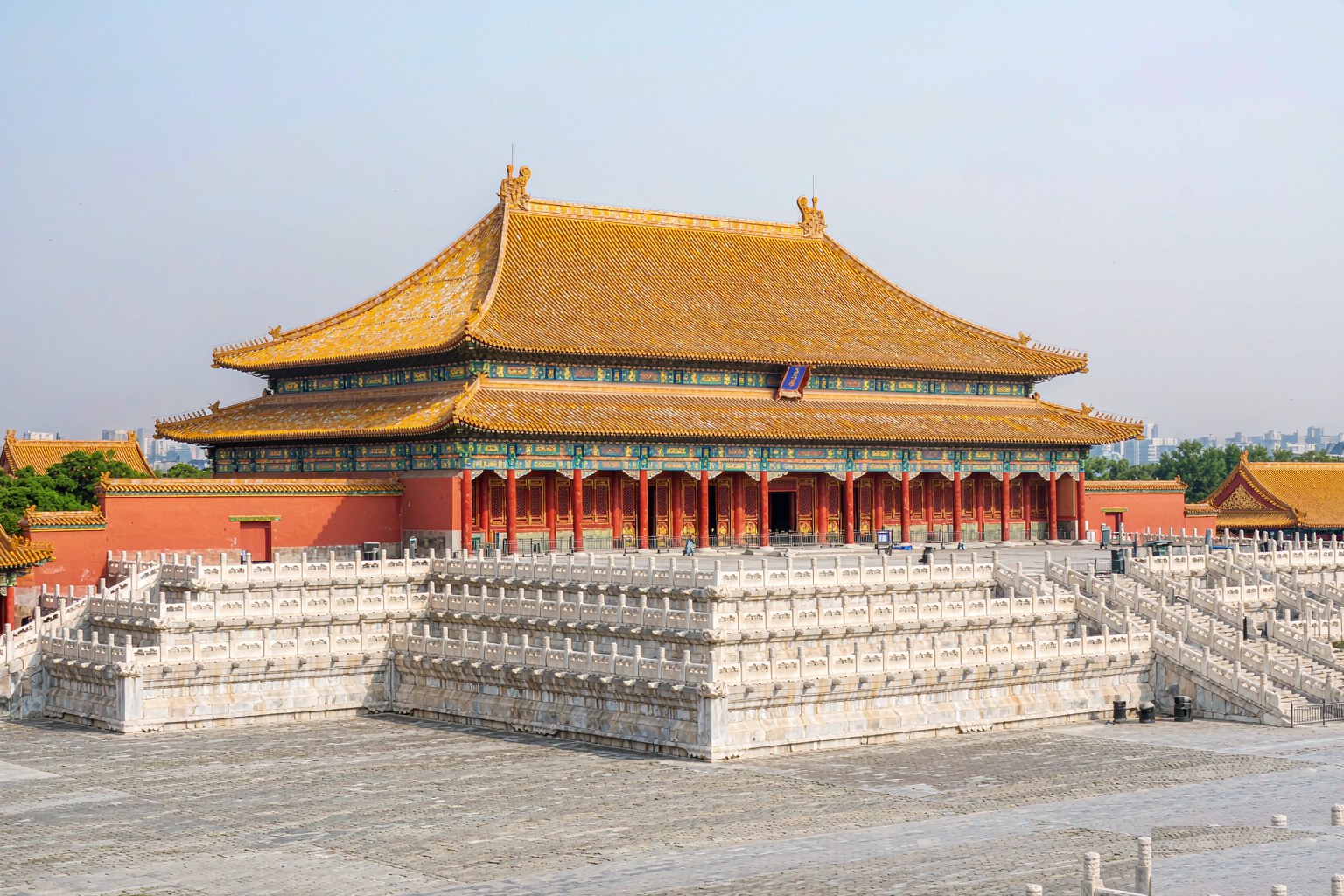 Visitors crossing the grand courtyard of the Forbidden City in Beijing
