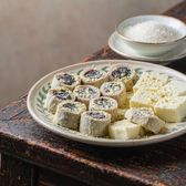 Ludagun, rolled glutinous rice bars dusted in soy flour