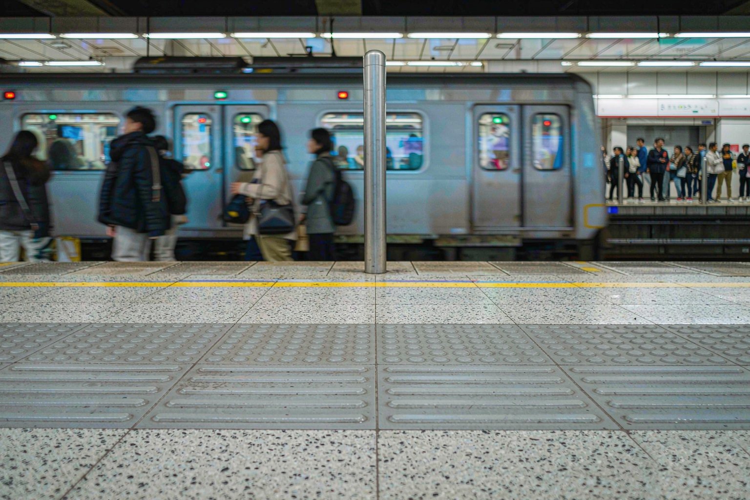A subway train arriving at a metro platform in China