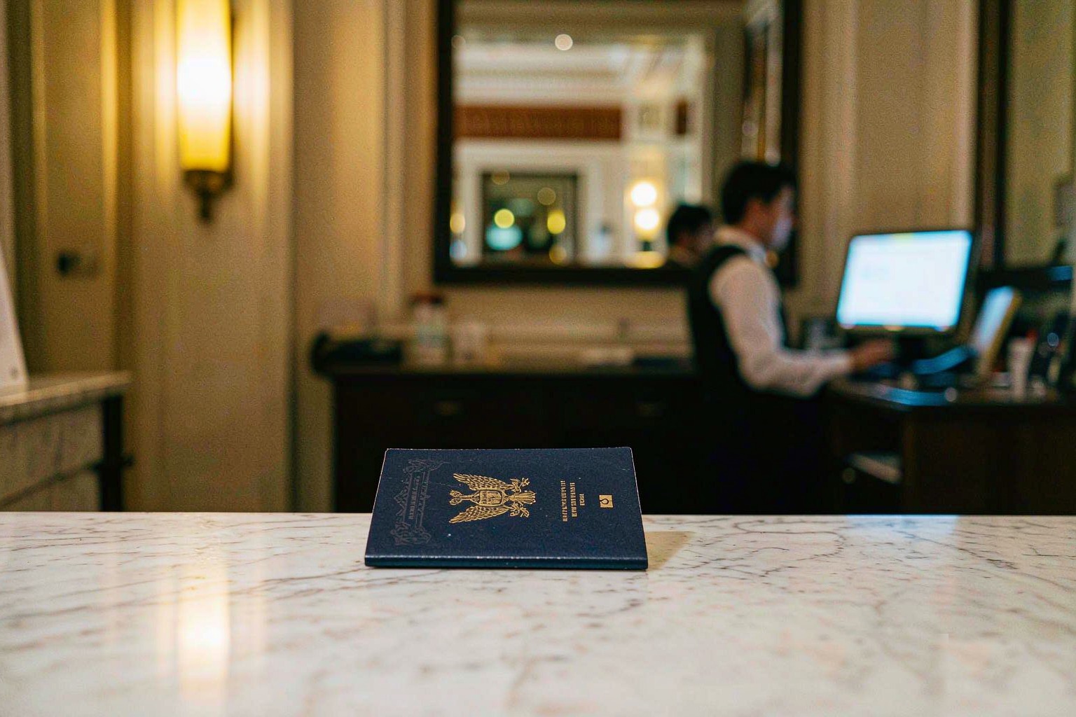 A foreign passport on a hotel reception counter in China