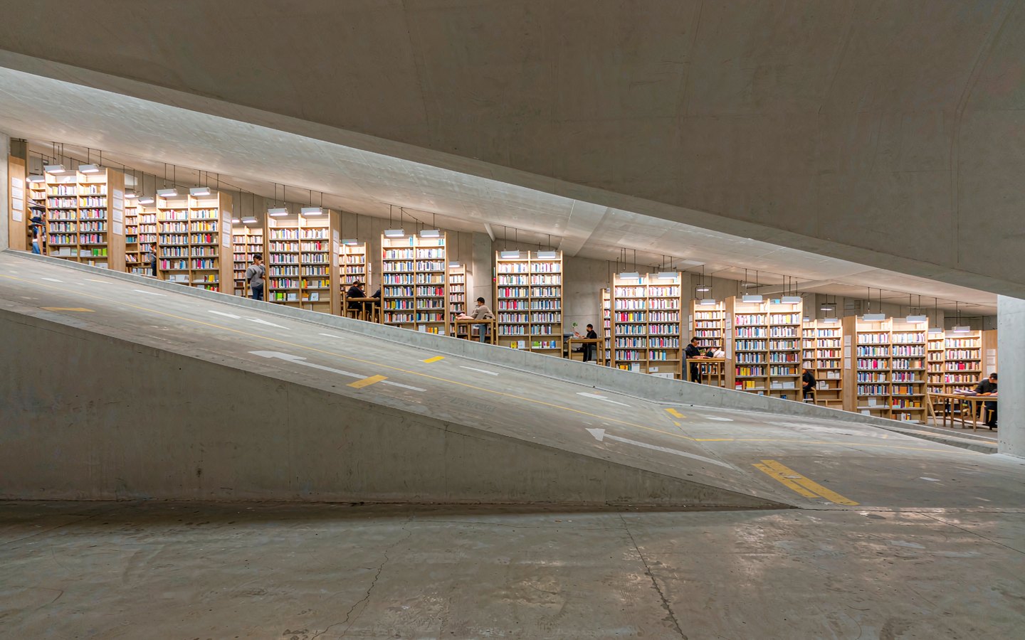 Bookshop aisles running down a converted car-park ramp